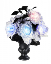 Vase mit leuchtenden Rosen