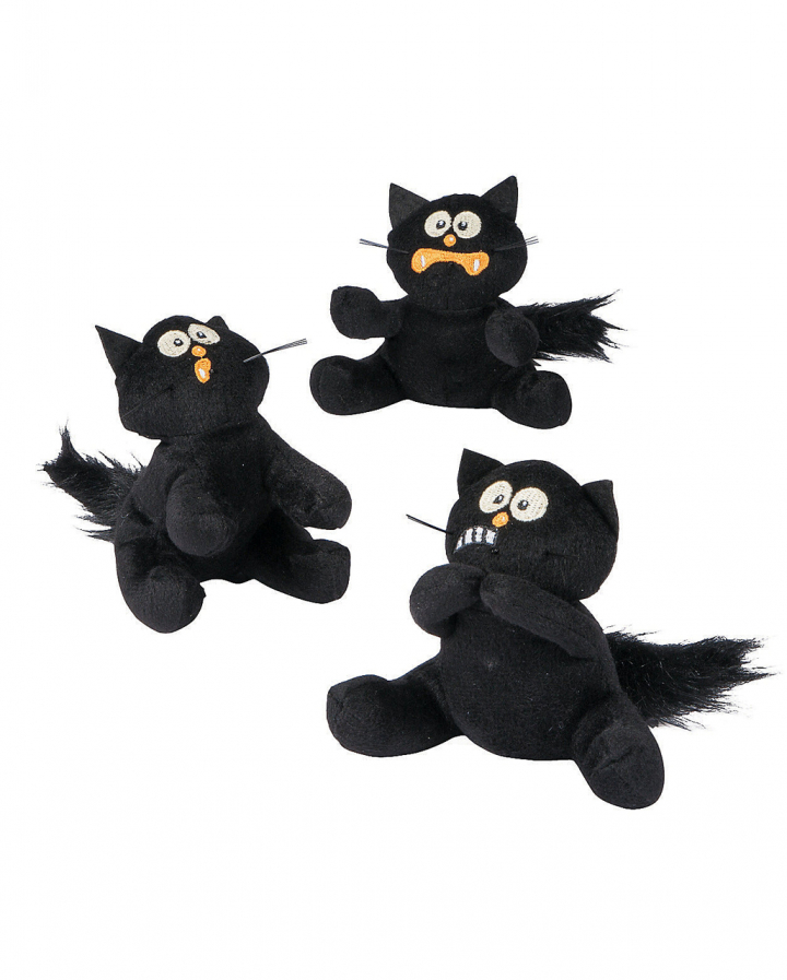 plush black cat with green eyes